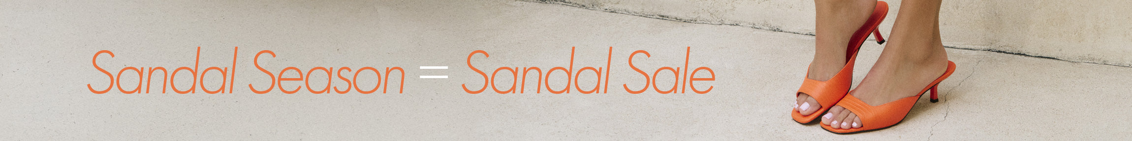 orange sandals on a concrete floor with the copy sandals season  = sandal sale 