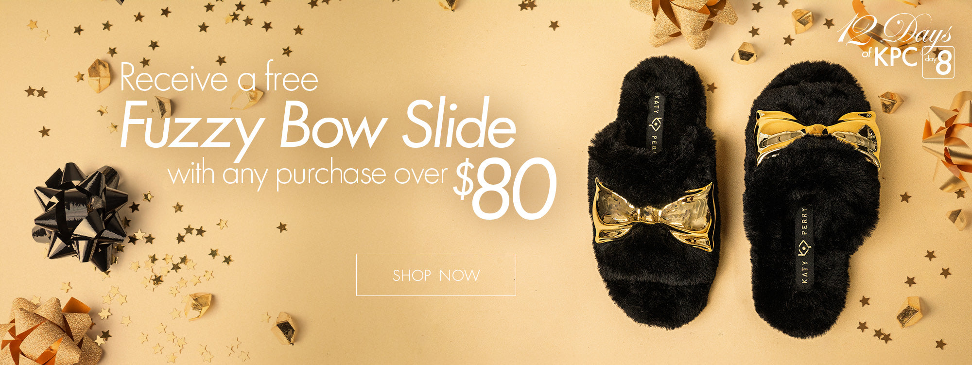 Black Fuzzy Slipper with gold bow.  Receive a Fuzzy Sipper with any purchase over $80